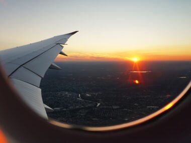 airplanes window view of sky during golden hour